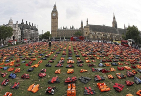Activists cover London square with life jackets to commemorate drowned refugees